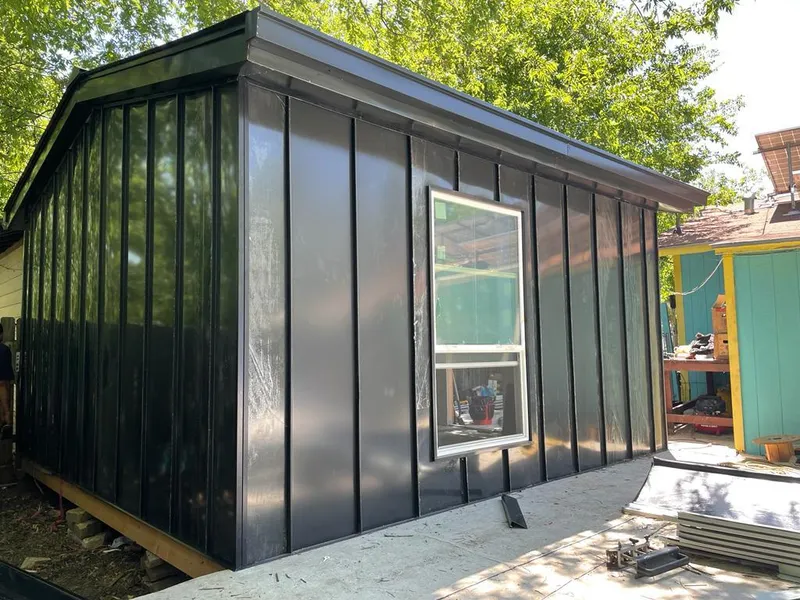 Black standing seam metal wall panels for Roof Inspection in Garfield