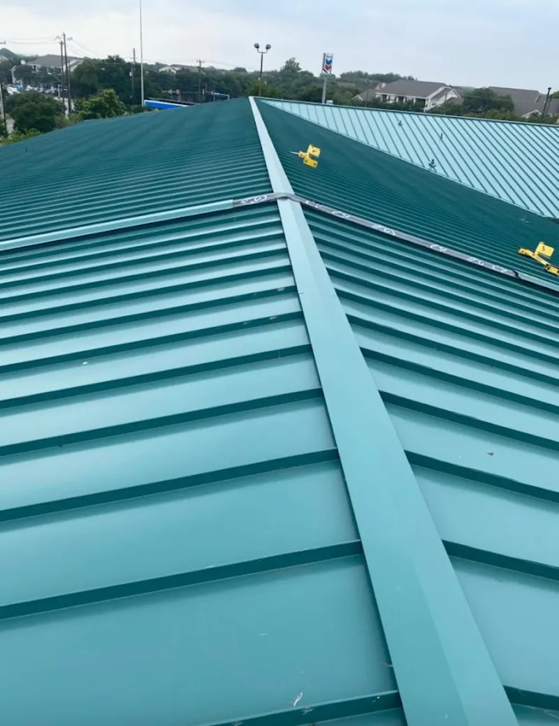 Green commercial metal roof ridge and valley for Metal Roof Repair in Garfield