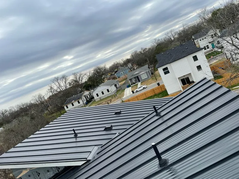 Standing seam metal roof panels with vents for Skylight Repair in Garfield